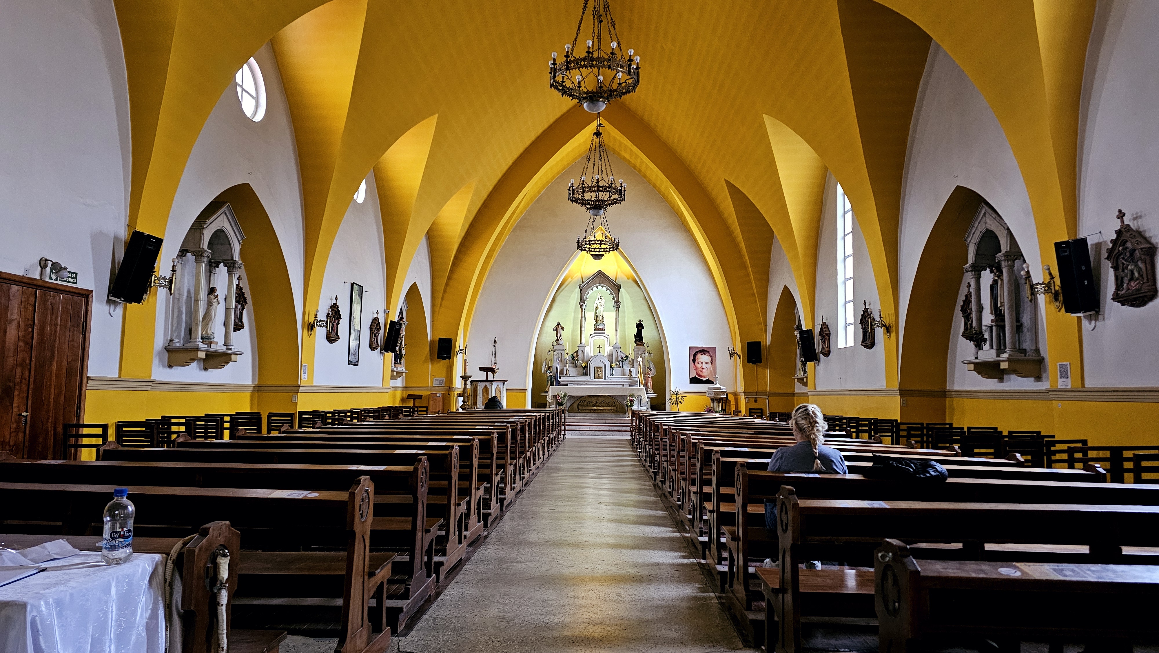 Inside the cathedral in Ushuaia with canary yellow arched ceiling