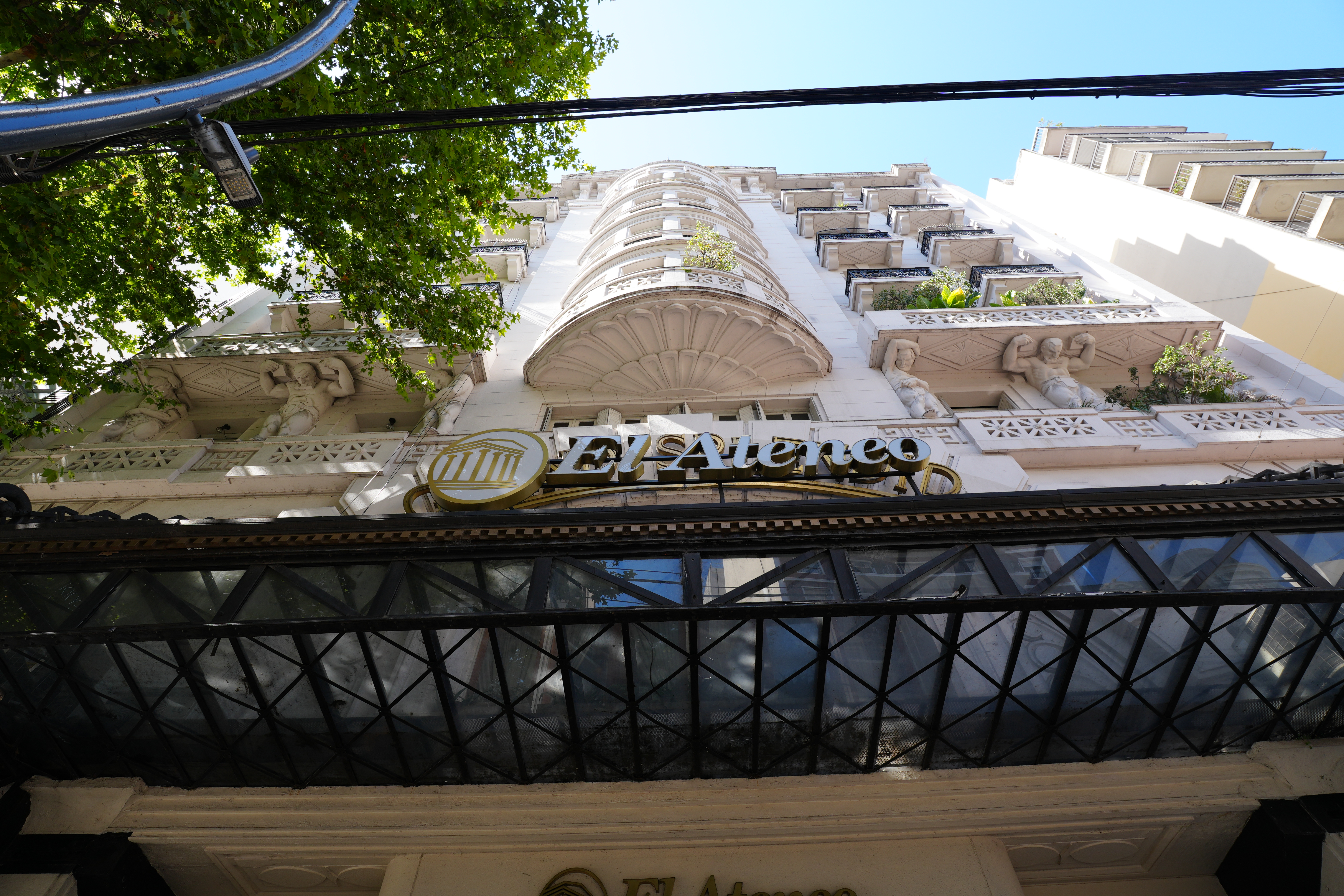 Exterior upward view of El Ateneo facade and balconies.