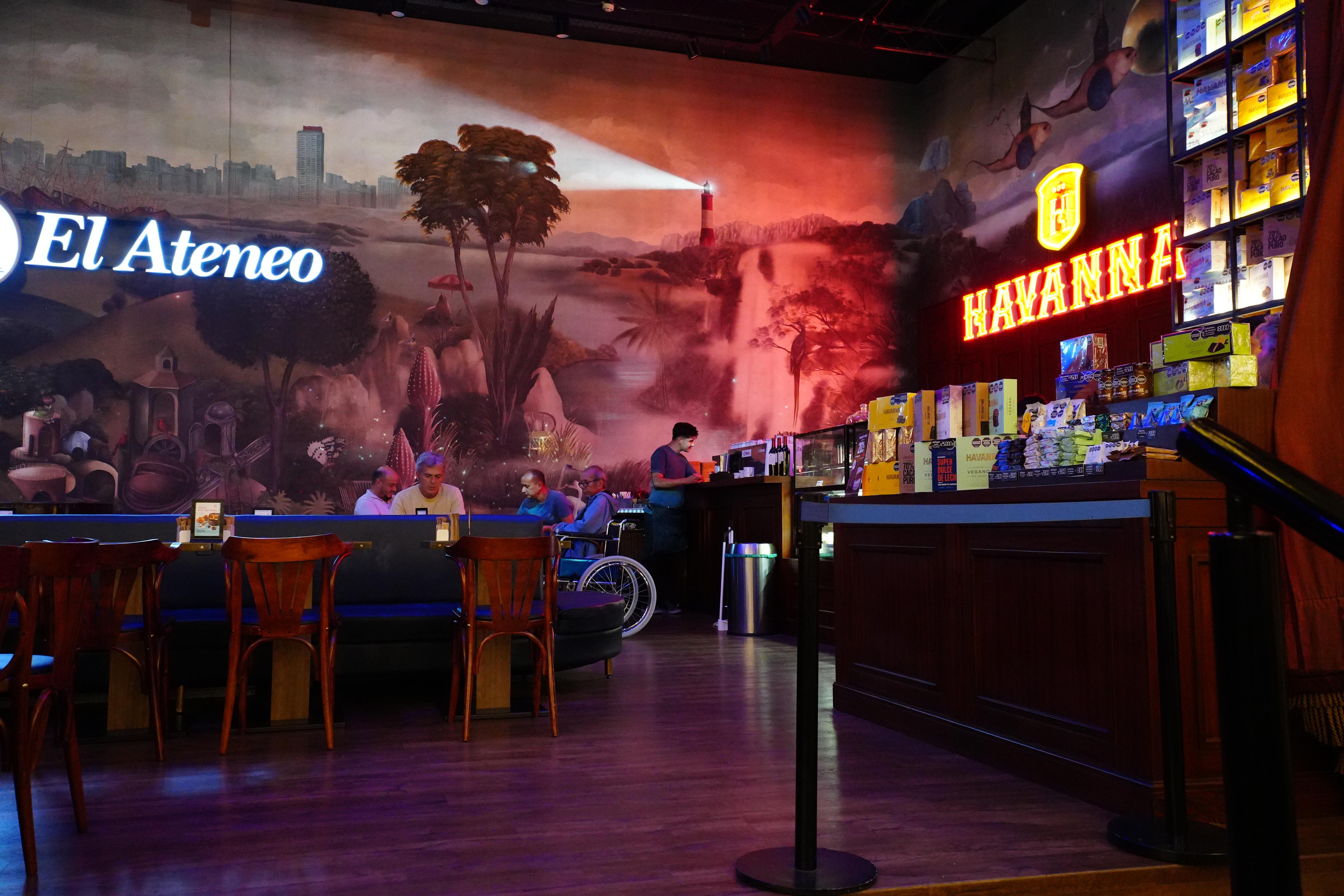 Mural wall and seating area inside Havanna café.