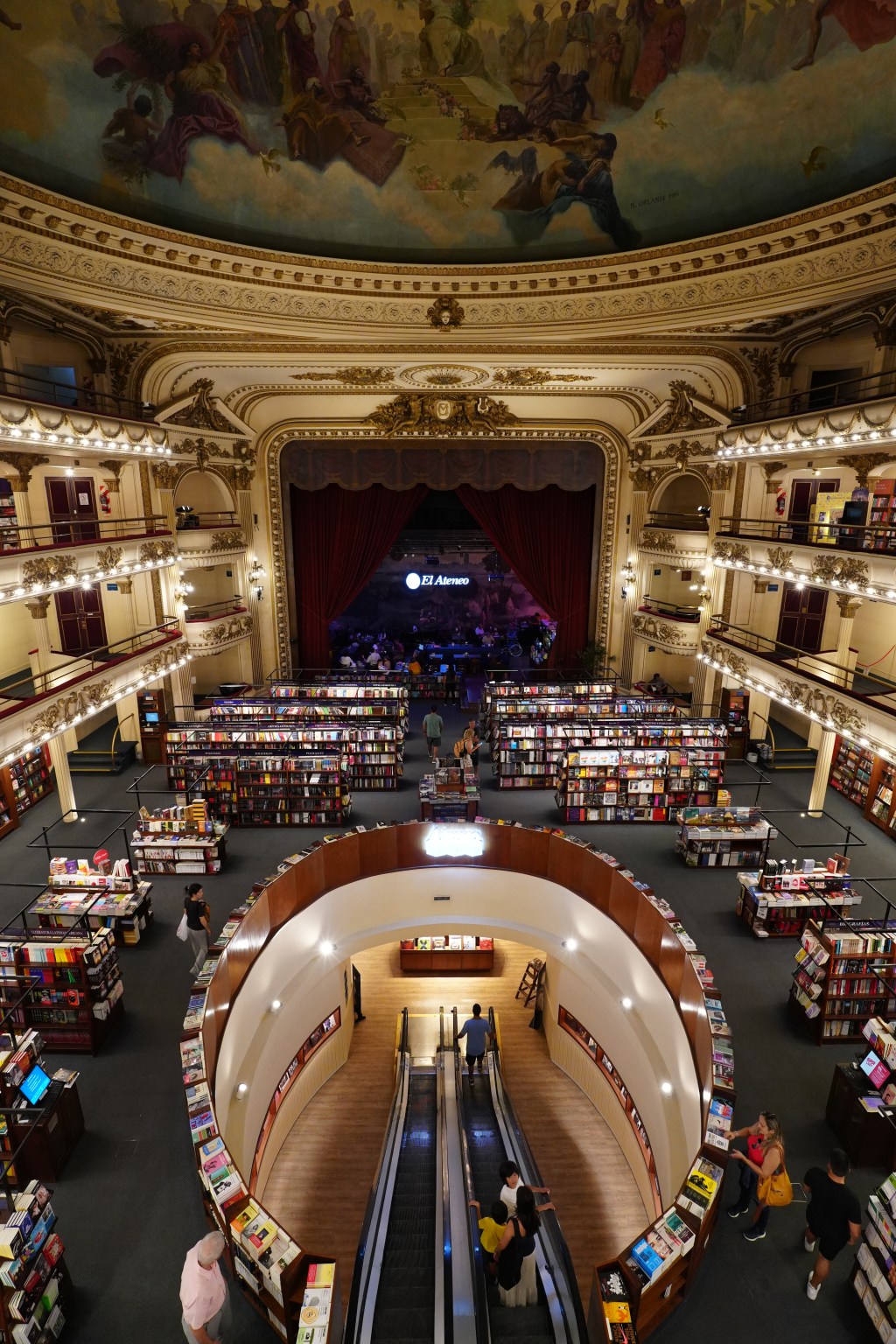 Wide shot from back of store with theater stage in view.