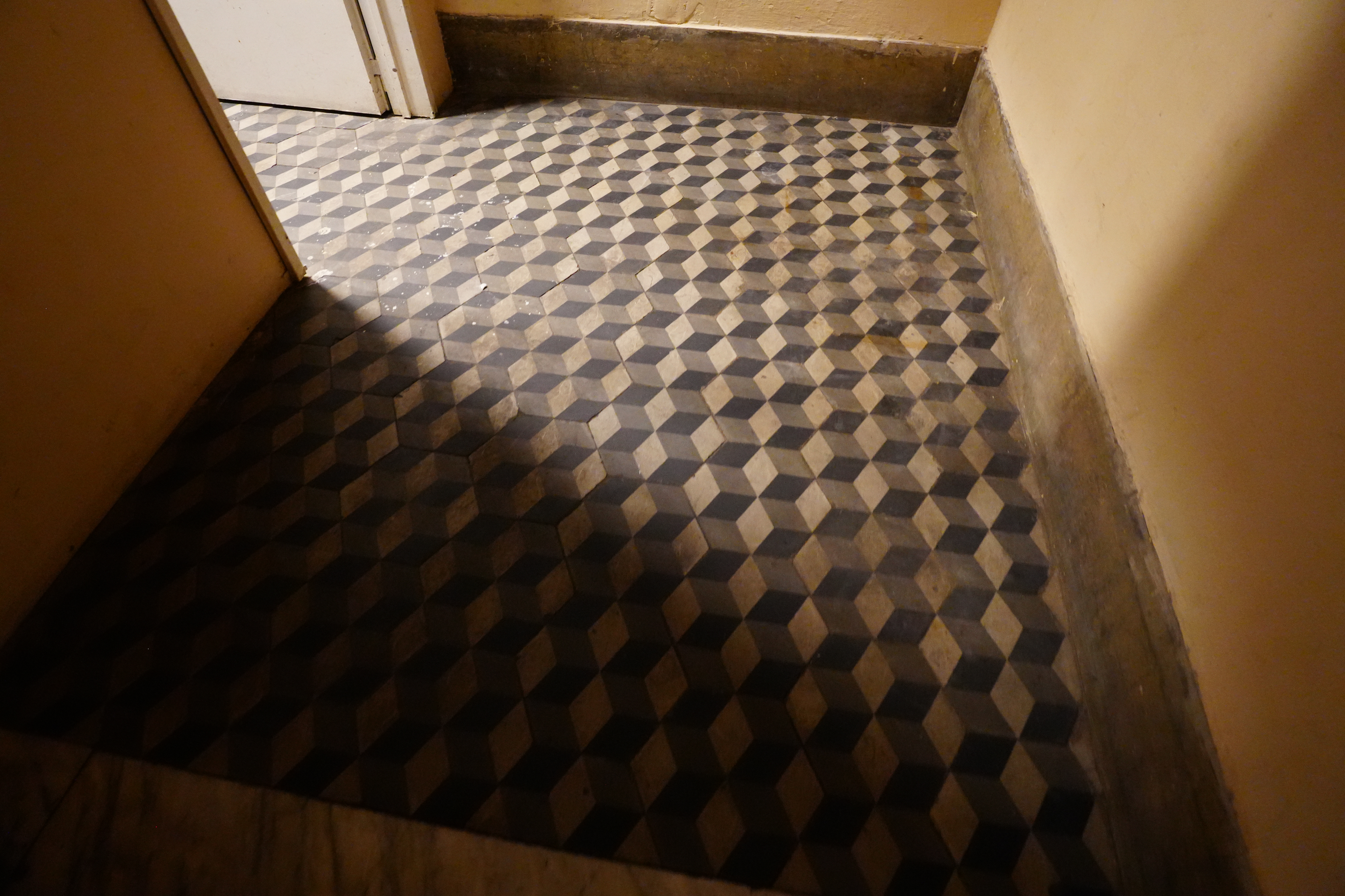 Geometric checkered tile floor near El Ateneo stairwell.	