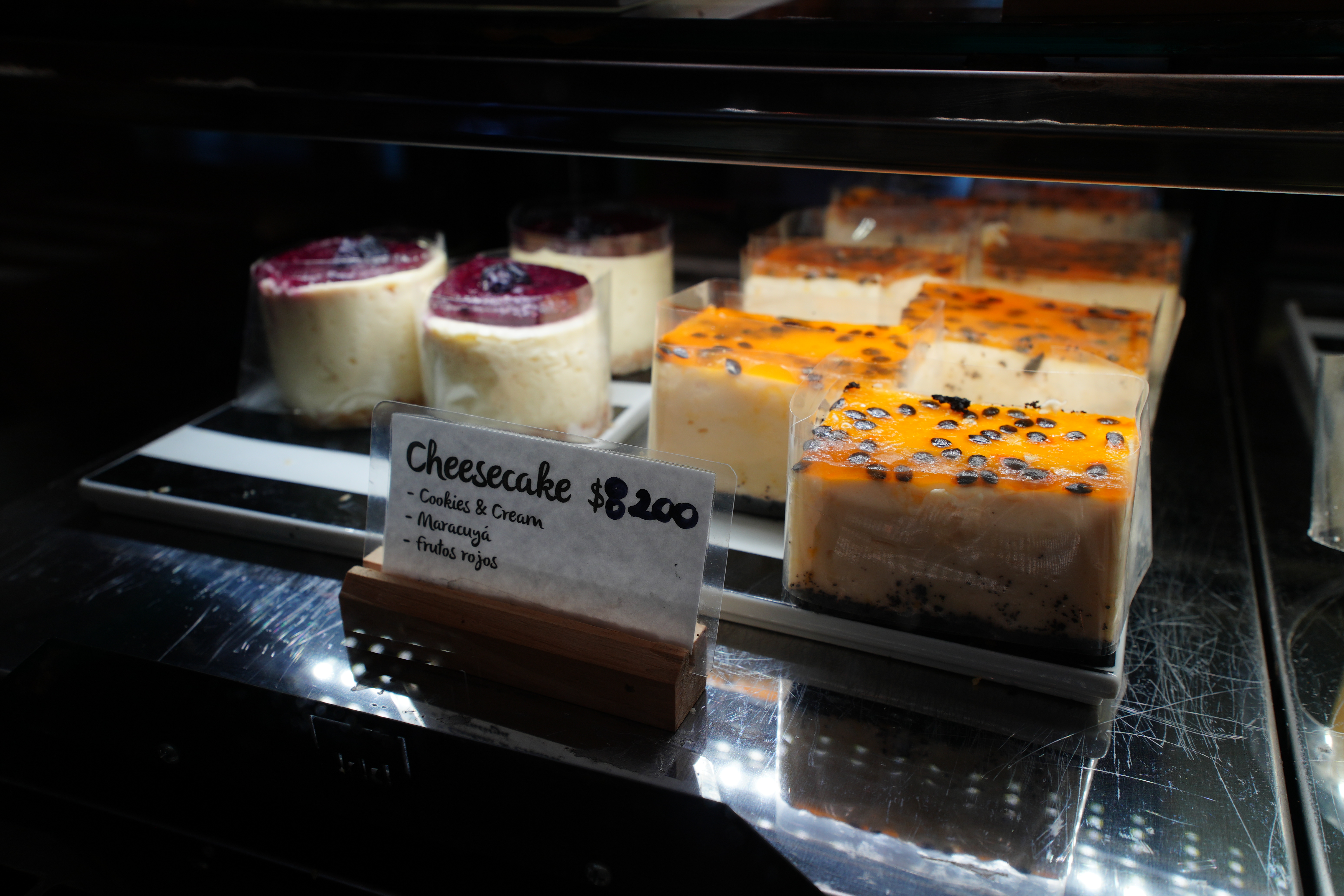 More desserts inside the cold case, with prices shown.