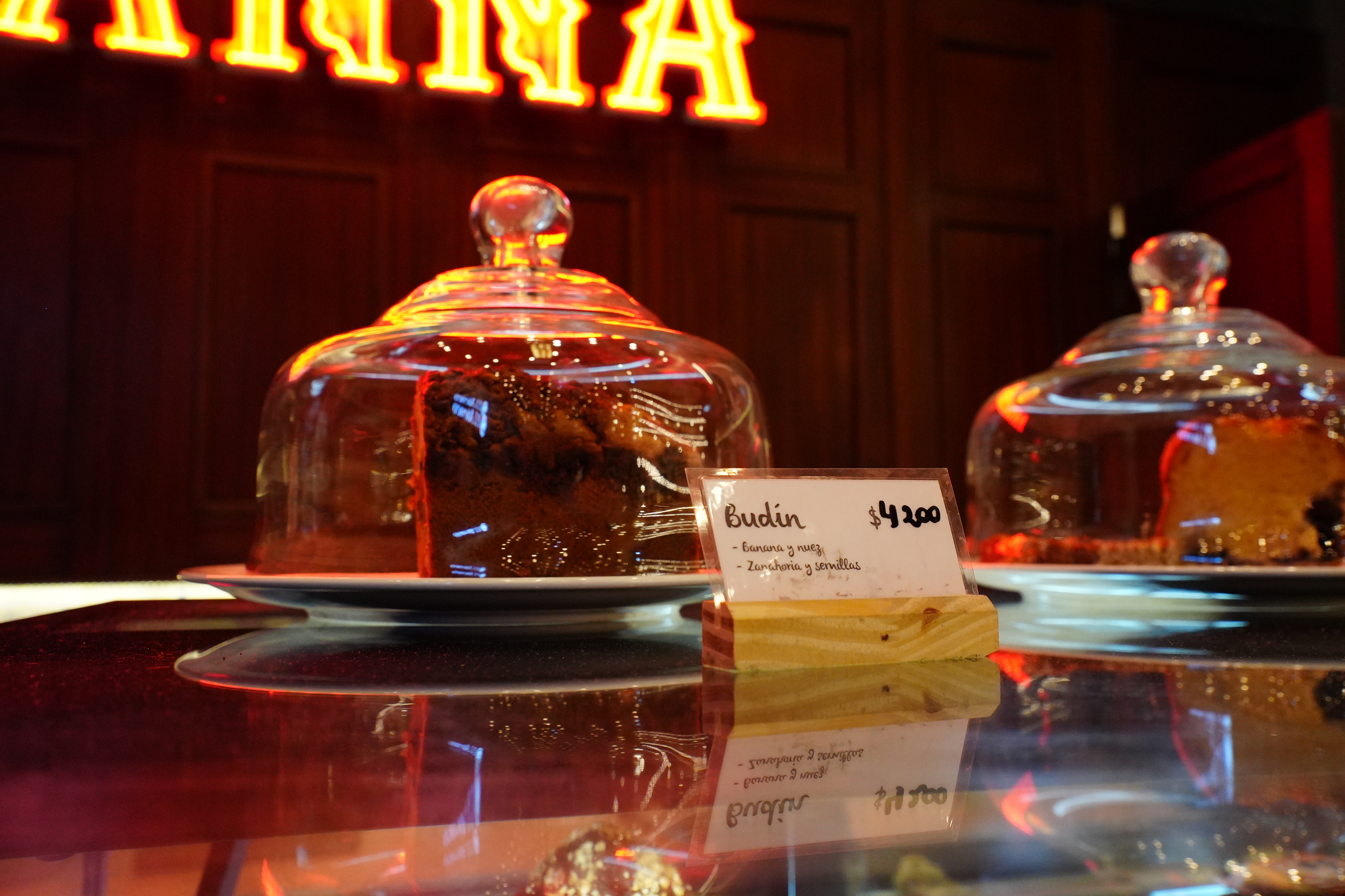 Cake under glass dome at Havanna counter.