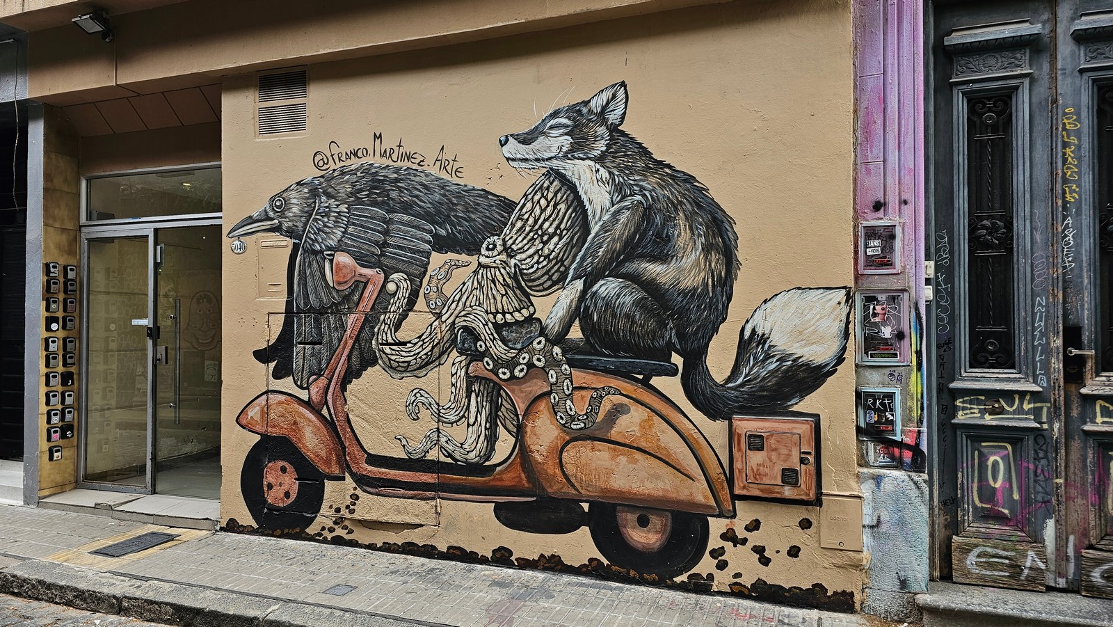 Mural of a crow, octopus, and fox riding a scooter by @Franco.Martinez.Arte