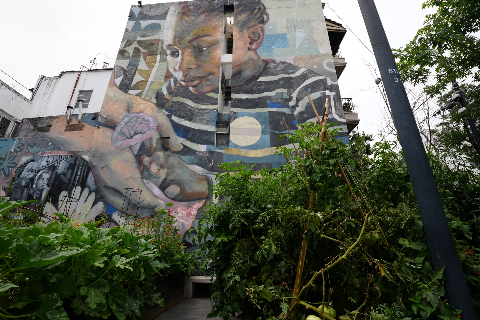 Mural showing a man and child in a touching moment