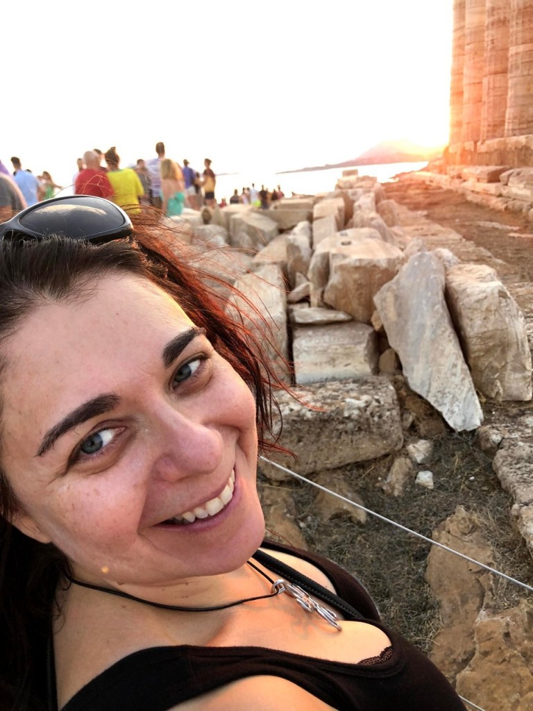 Crowds gathering at the Cape Sounion viewpoint before sunset