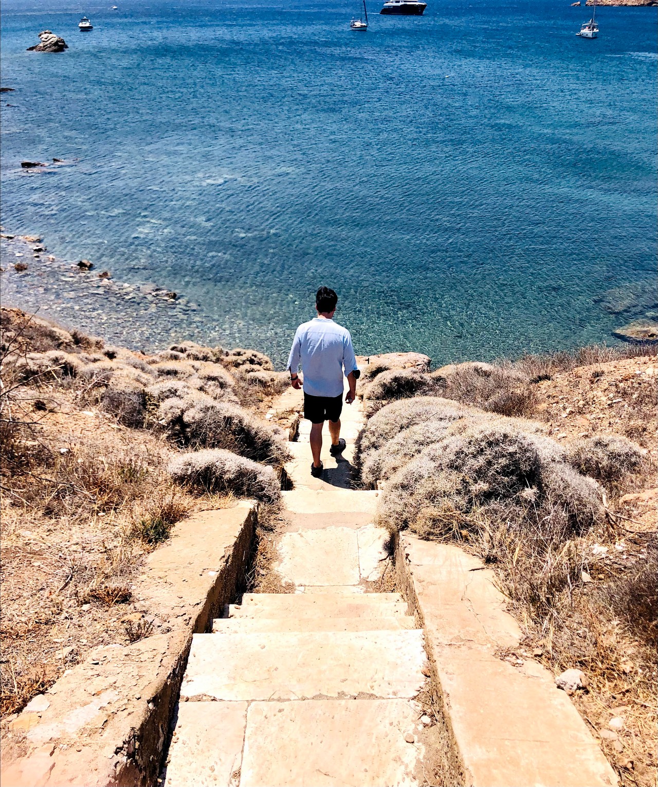 Stone steps leading down a coastal path to the sea near Cape Sounion